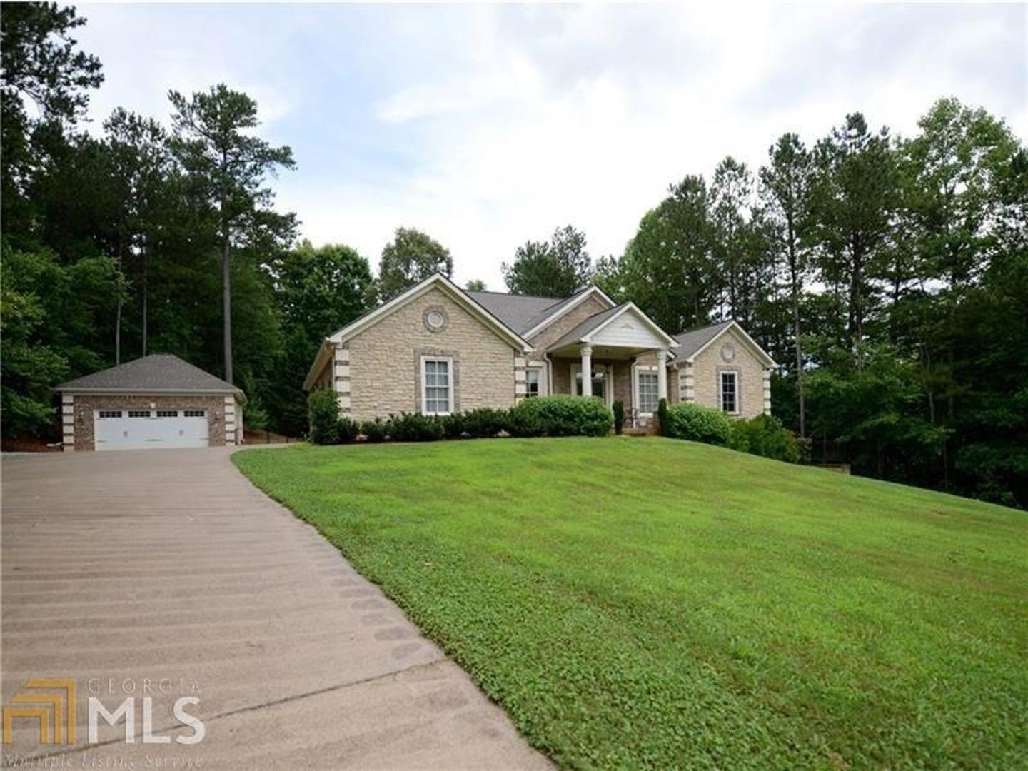 Gorgeous 3 sided brick ranch features a detached garage and 2nd driveway leading to the covered RV/Boat parking and full finished basement! SMART HOME!  Beautiful 2 acre wooded lot!  NO HOA!