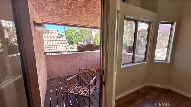 a view of a hallway with a window