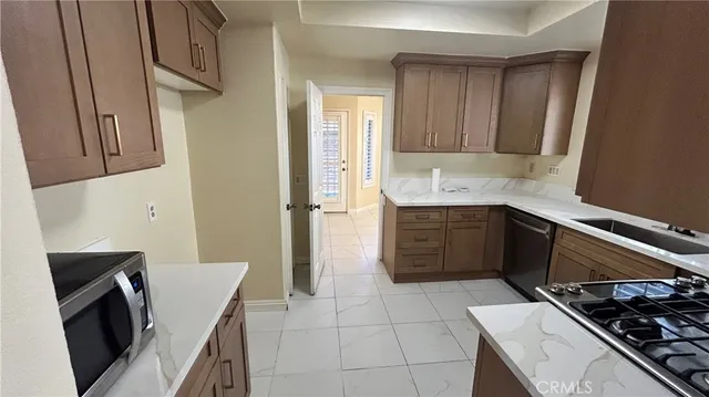 a kitchen with a stove and a refrigerator