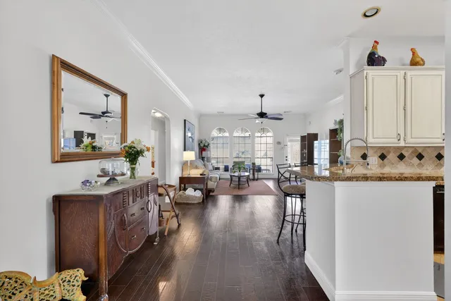 a view of a living room and kitchen