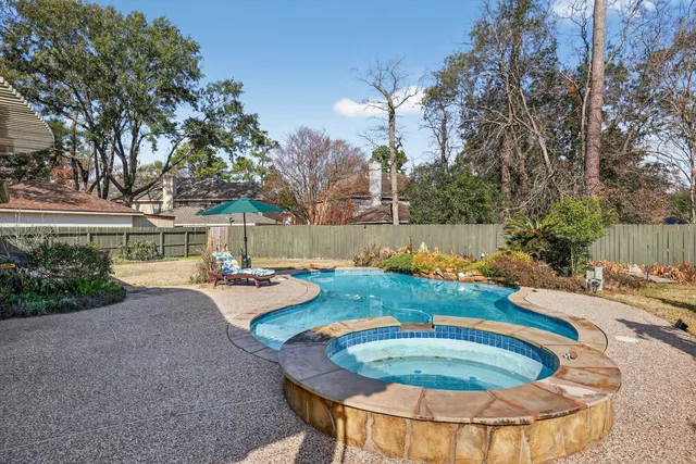 a view of a house with swimming pool and porch