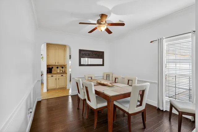 a view of a dining room with furniture and wooden floor