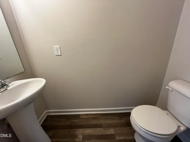 a bathroom with a toilet and a sink