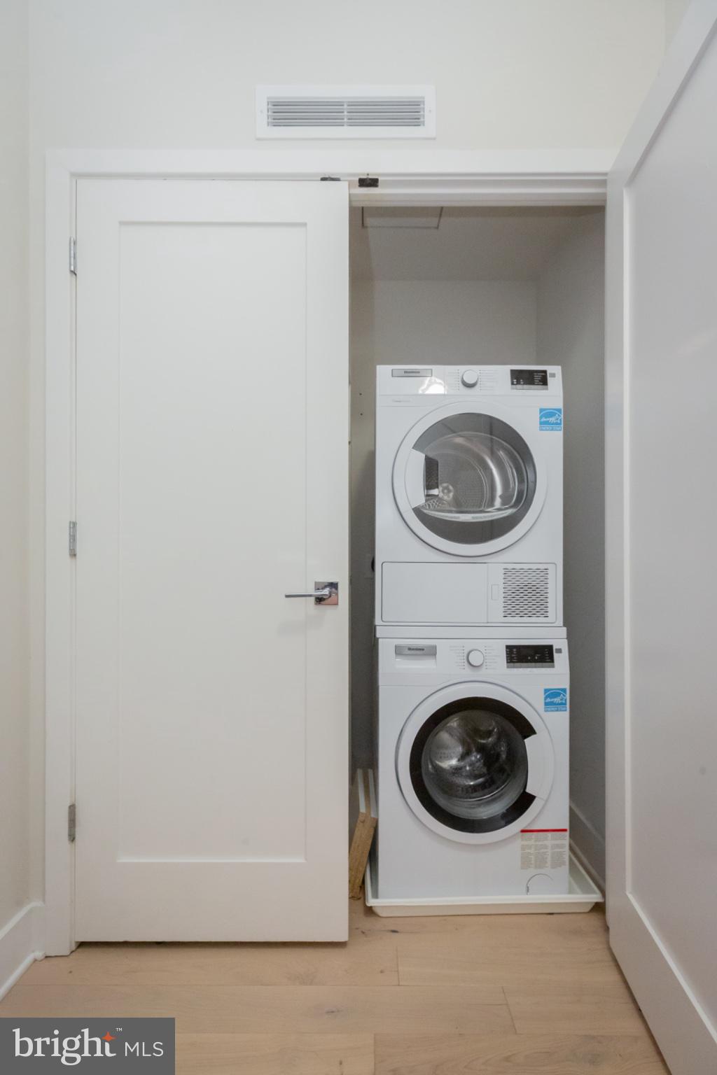 1211 Van Street Southeast, Unit TH1C Washington, DC 20003 - Photo 4 of 31 Efficient laundry nook in modern design.