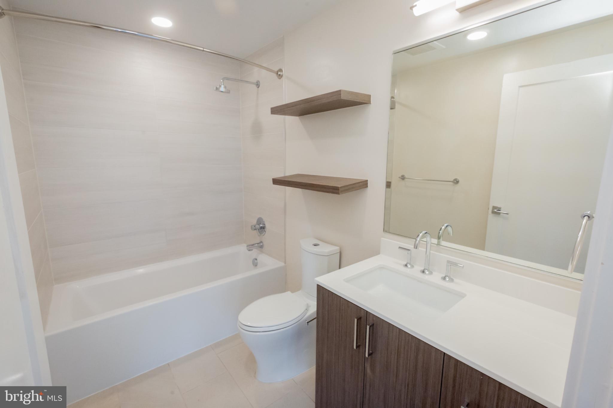 1211 Van Street Southeast, Unit TH1C Washington, DC 20003 - Photo 7 of 31 Sleek modern bathroom with clean lines.
