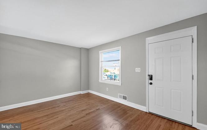 60 South Hawthorne Road Middle River, MD 21220 - Photo 17 of 18 an empty room with wooden floor and windows