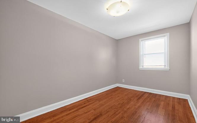 60 South Hawthorne Road Middle River, MD 21220 - Photo 7 of 18 a view of a room with wooden floor and windows