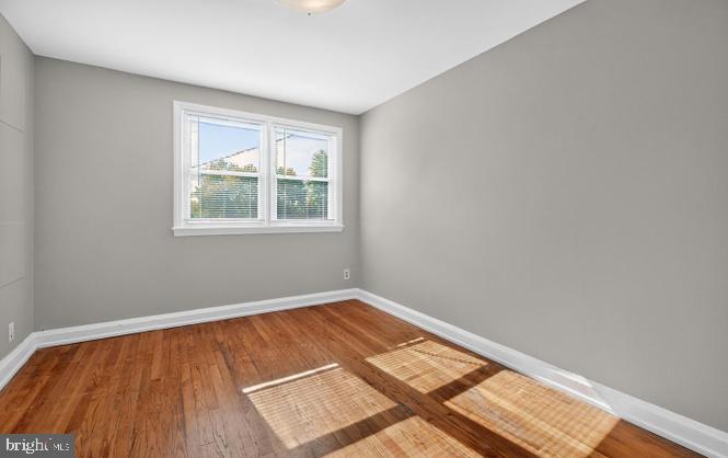 60 South Hawthorne Road Middle River, MD 21220 - Photo 9 of 18 an empty room with wooden floor and windows