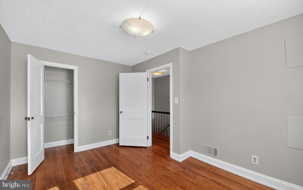 60 South Hawthorne Road Middle River, MD 21220 - Photo 10 of 18 an empty room with wooden floor and closet