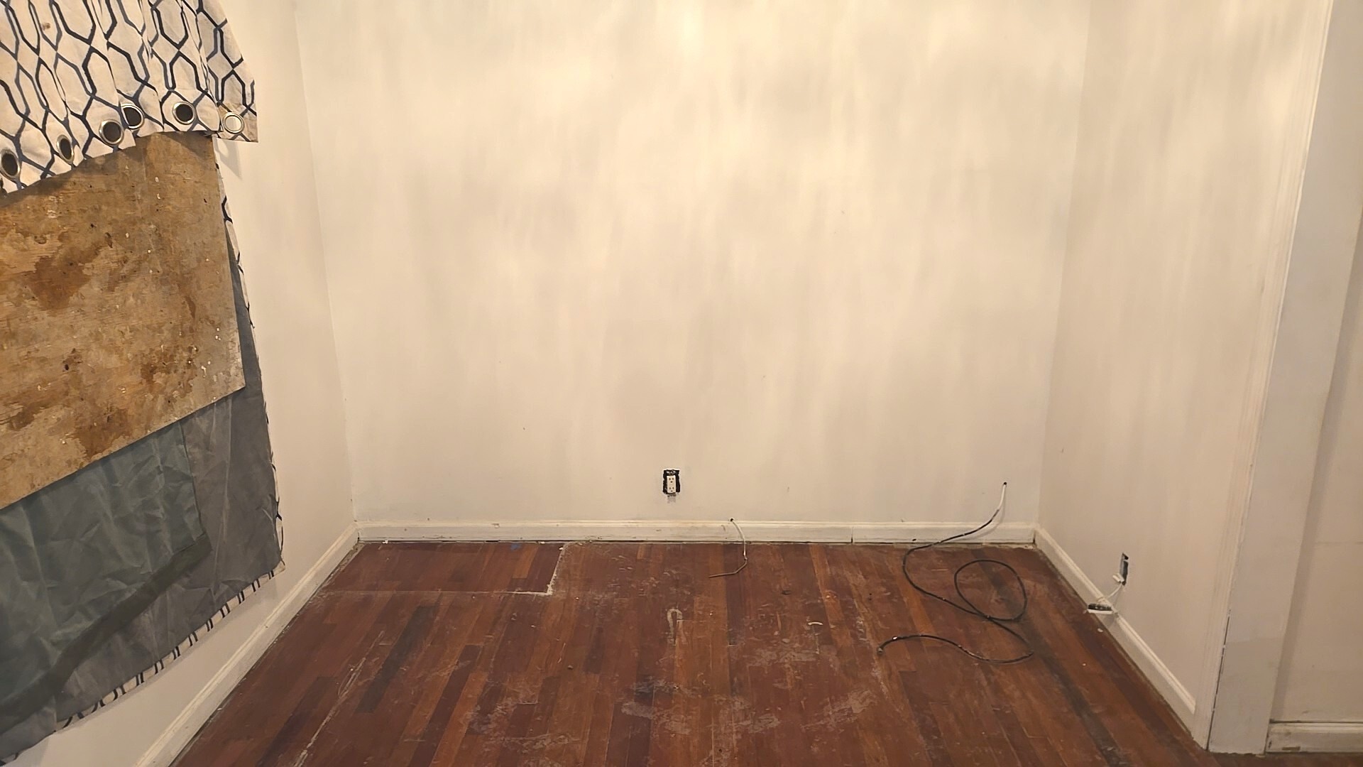 8216 South Rhodes Avenue Chicago, IL 60619 - Photo 15 of 22 a view of a small space with wooden floor and a window