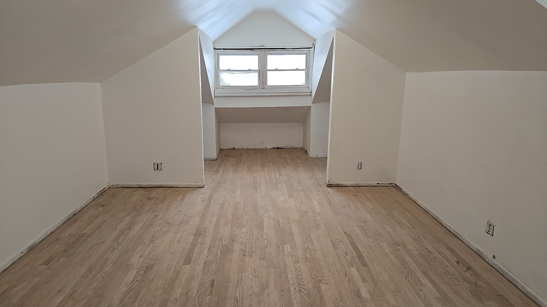 8216 South Rhodes Avenue Chicago, IL 60619 - Photo 18 of 22 an empty room with wooden floor and windows