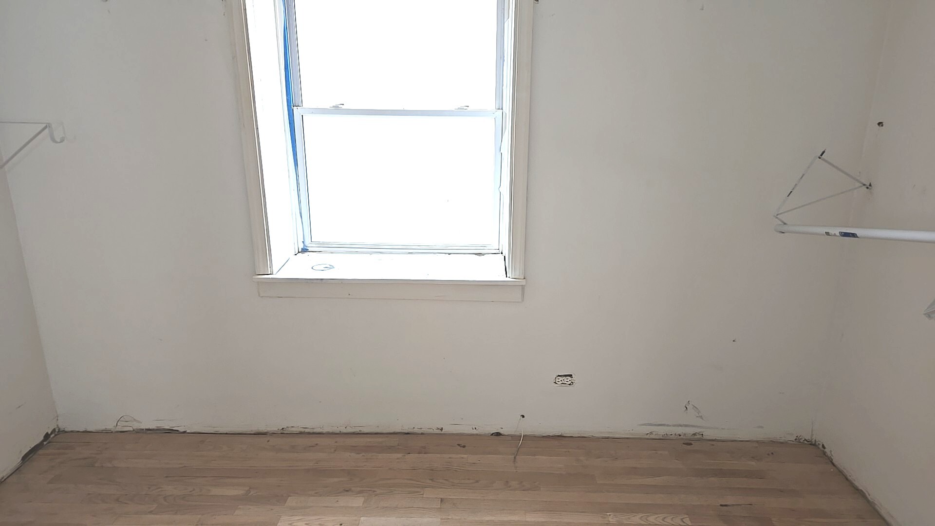 8216 South Rhodes Avenue Chicago, IL 60619 - Photo 19 of 22 a view of a small space with wooden floor and a window