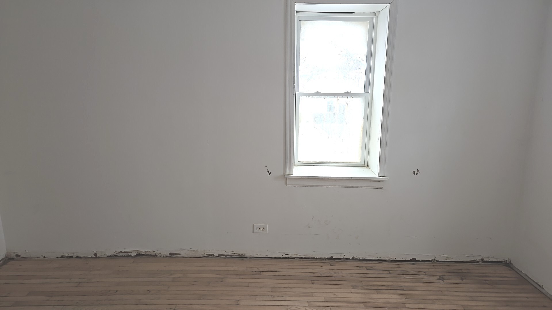 8216 South Rhodes Avenue Chicago, IL 60619 - Photo 20 of 22 a view of wooden floor and windows in a room