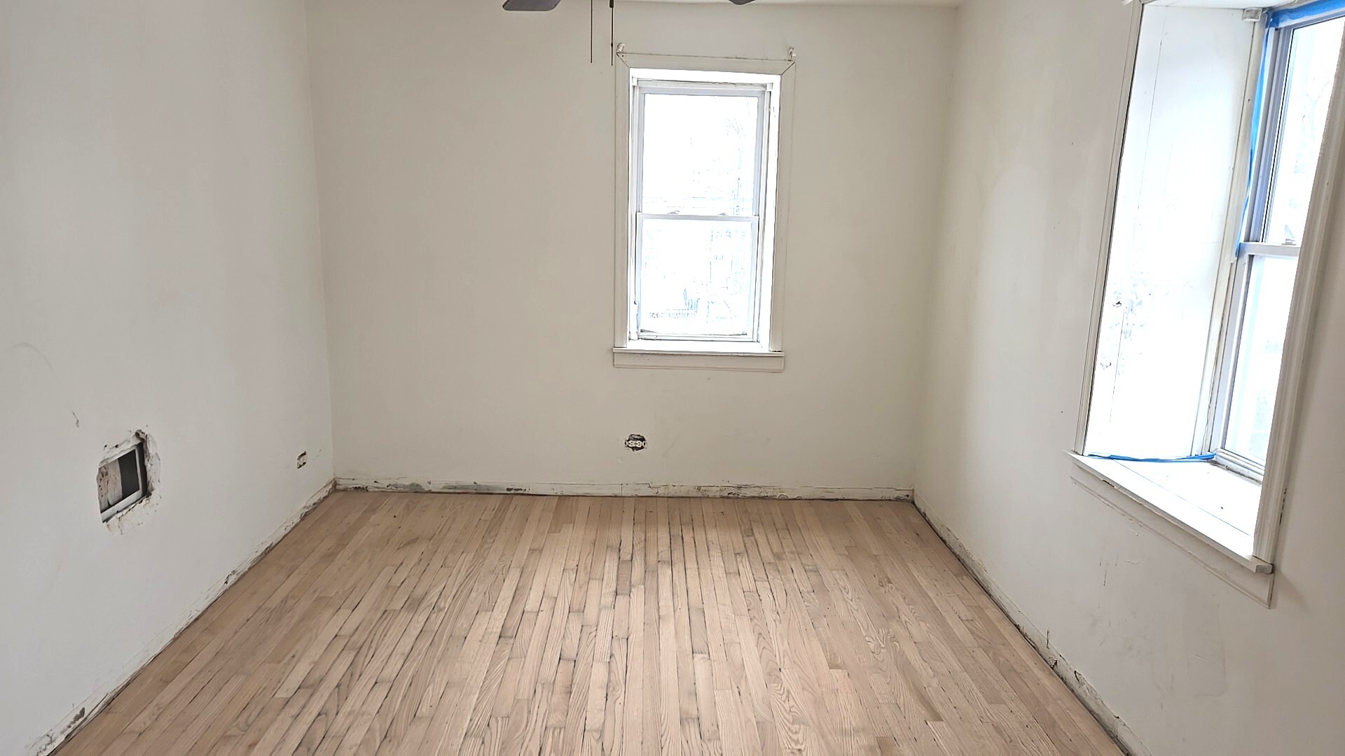 8216 South Rhodes Avenue Chicago, IL 60619 - Photo 21 of 22 an empty room with a window
