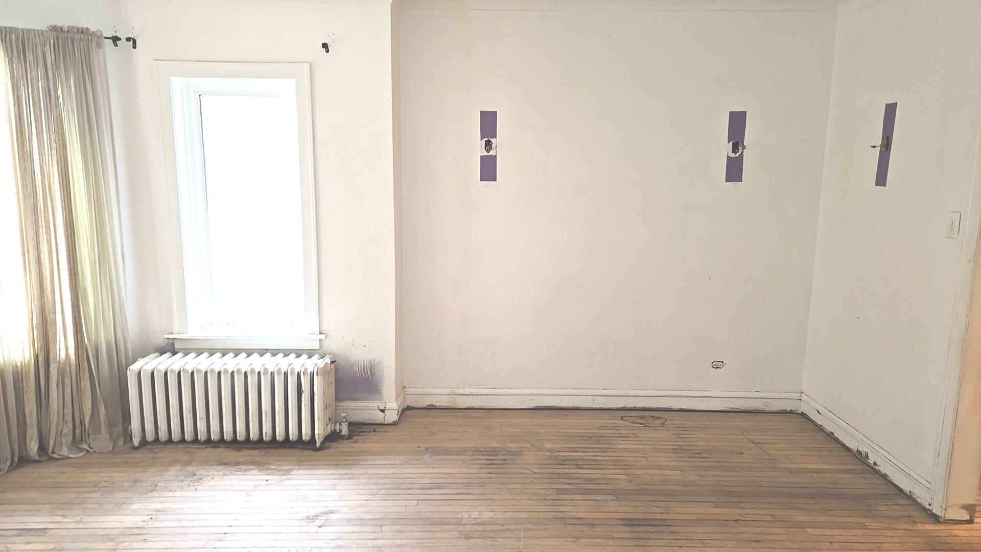 8216 South Rhodes Avenue Chicago, IL 60619 - Photo 7 of 22 an empty room with wooden floor and windows