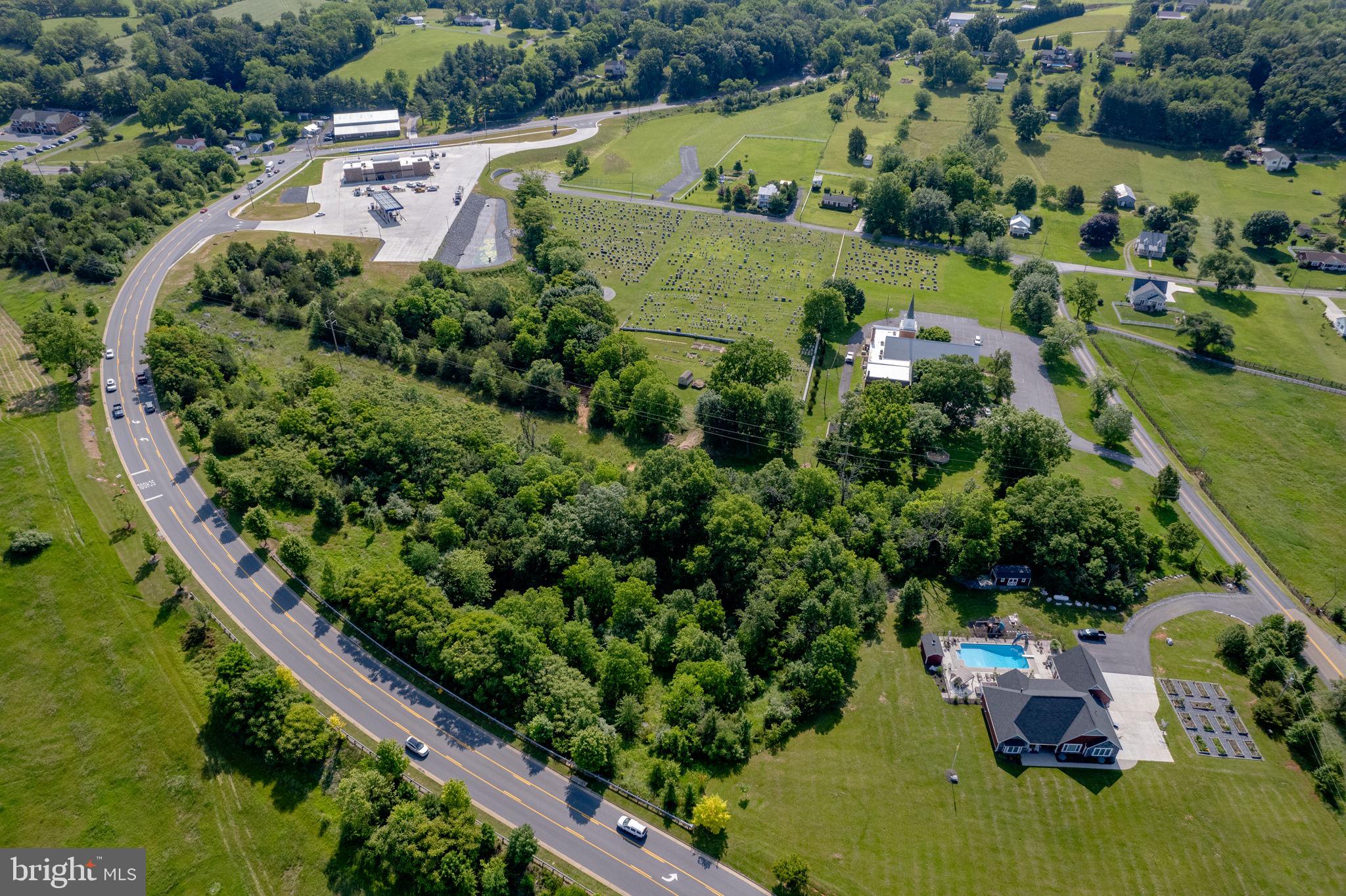 0 East Springbrook Road Broadway, VA 22815 - Photo 4 of 4 an aerial view of a house with a yard lake and green space