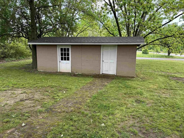 a backyard of a house with lots of green space