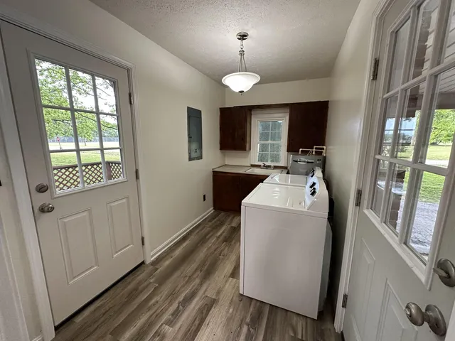 a view of living room with furniture and flat screen tv