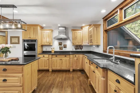 a bedroom with a large bed and a large window