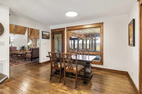 a large spacious bathroom with a granite countertop sink and a window