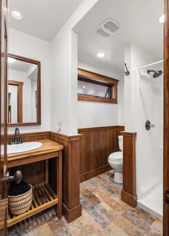 a kitchen with a sink stove top oven and cabinets