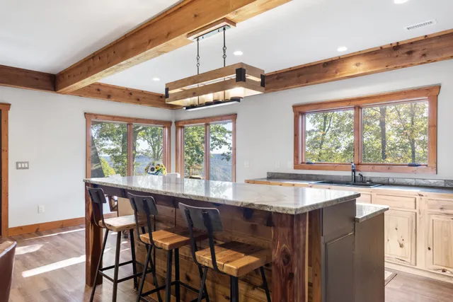 a bedroom with two beds and a large window