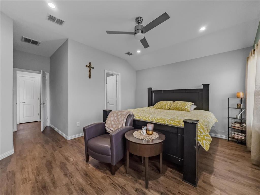 14201 Bridgeview Lane Dallas, TX 75253 - Photo 17 of 26 a view of livingroom and dining room with furniture wooden floor and a chandelier