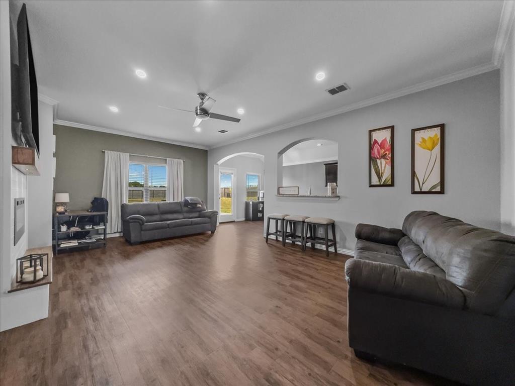 14201 Bridgeview Lane Dallas, TX 75253 - Photo 5 of 26 a living room with furniture and a wooden floor
