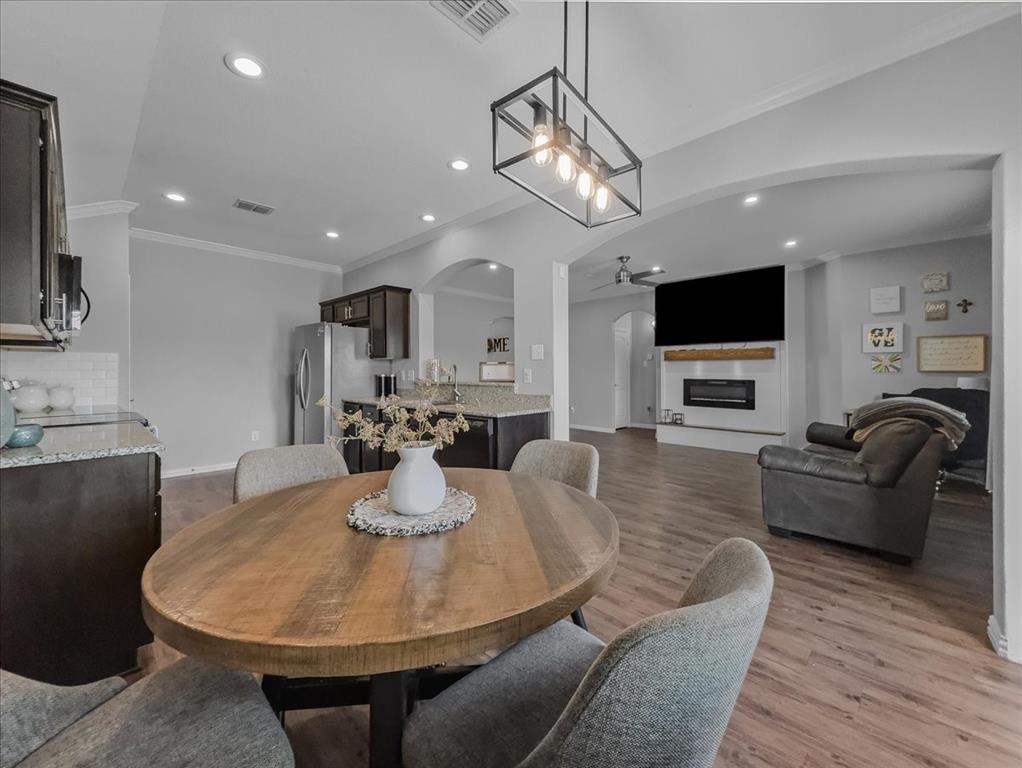 14201 Bridgeview Lane Dallas, TX 75253 - Photo 8 of 26 a living room with furniture a dining table and kitchen view