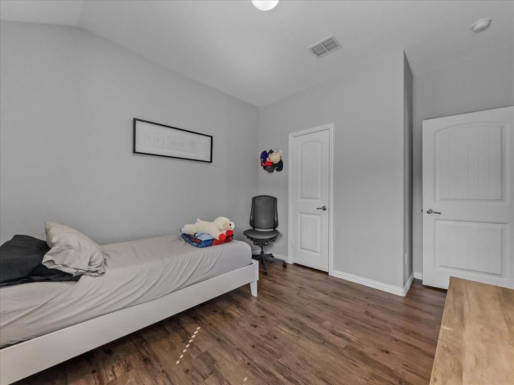 14201 Bridgeview Lane Dallas, TX 75253 - Photo 10 of 26 a bedroom with a bed and a window