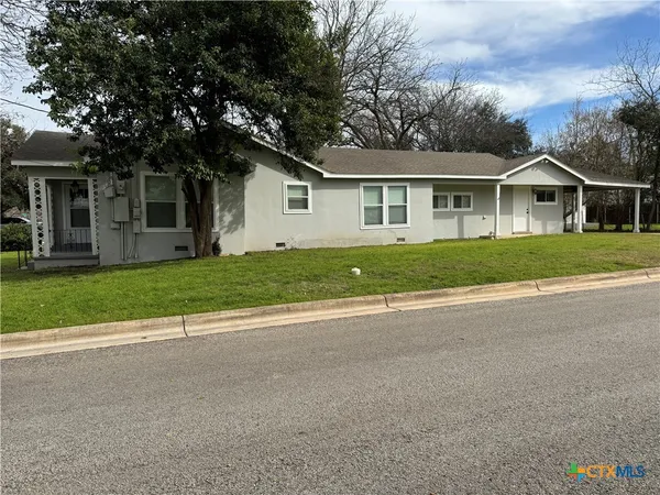 front view of a house and a yard