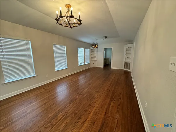 a view of a livingroom with wooden floor