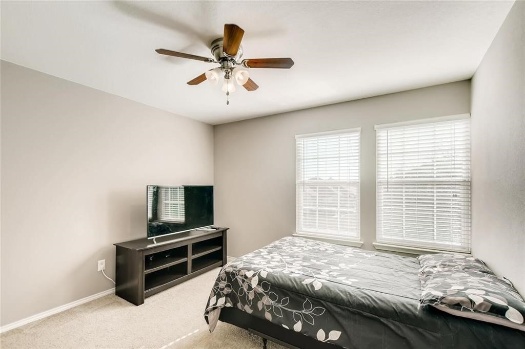 1149 Apollo Circle Round Rock, TX 78664 - Photo 13 of 14 a bedroom with a bed and a tv