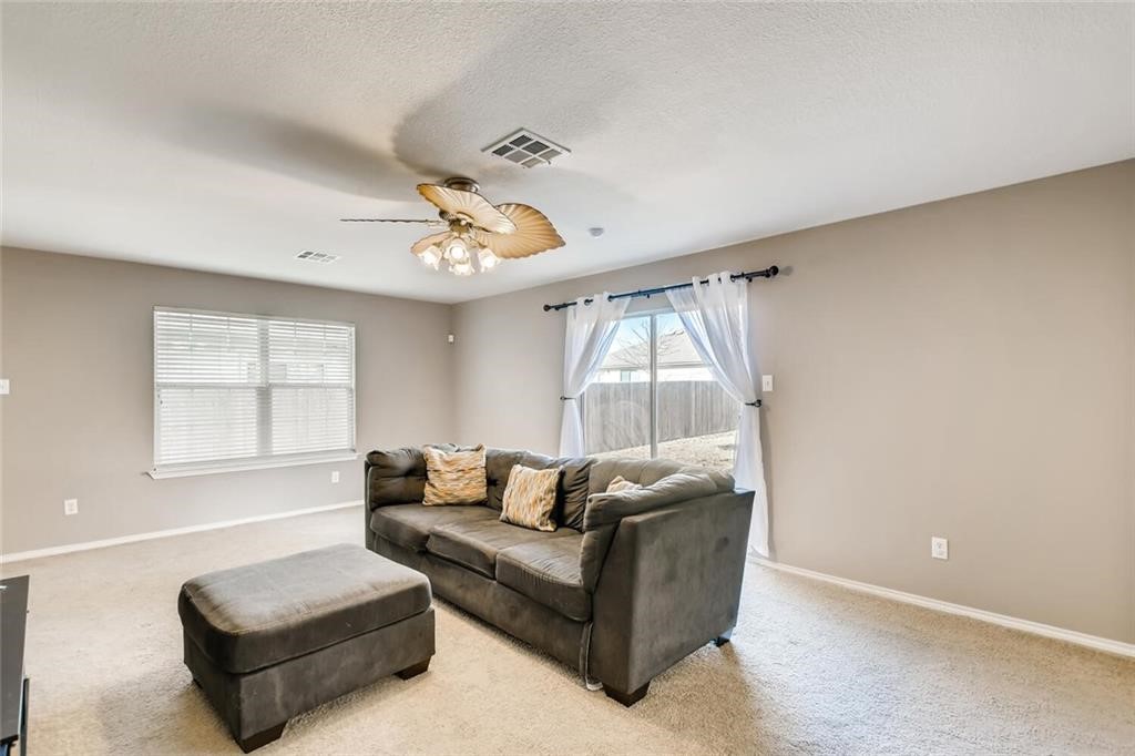 1149 Apollo Circle Round Rock, TX 78664 - Photo 8 of 14 a living room with furniture and a large window