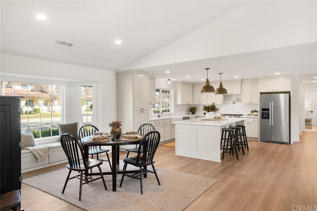 1985 Durango Way Chico, CA 95926 - Photo 18 of 65 a kitchen with a dining table chairs and white cabinets