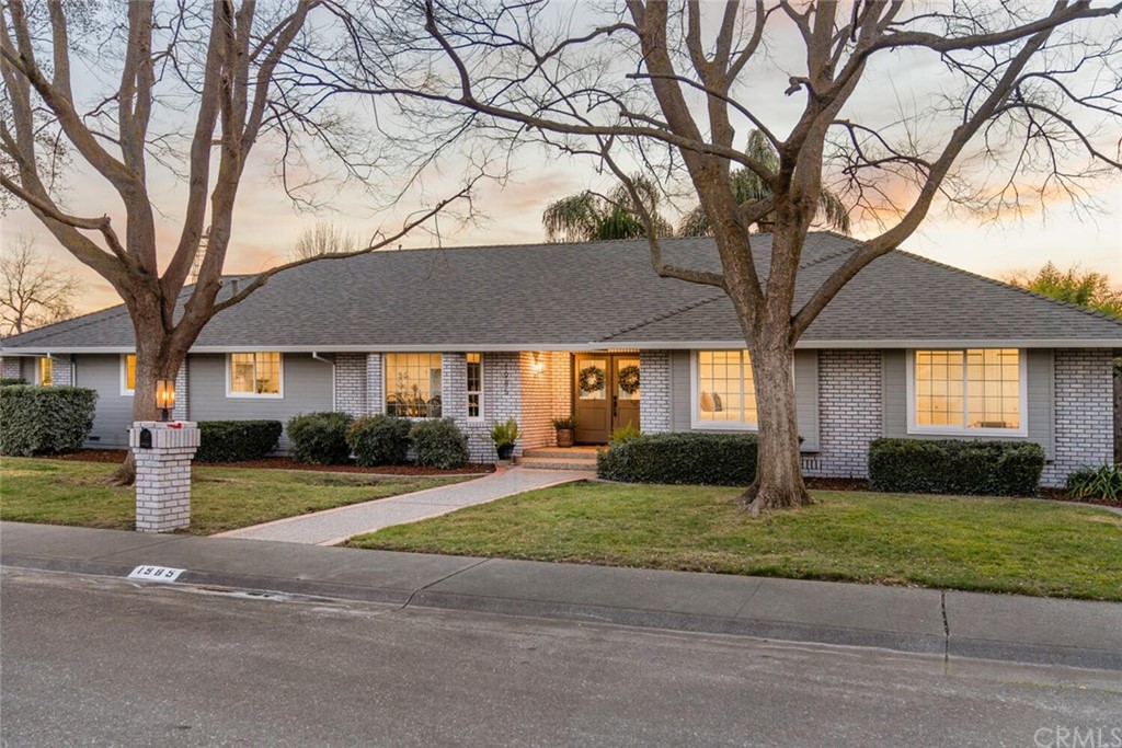 1985 Durango Way Chico, CA 95926 - Photo 2 of 65 a front view of a house with a yard and garage