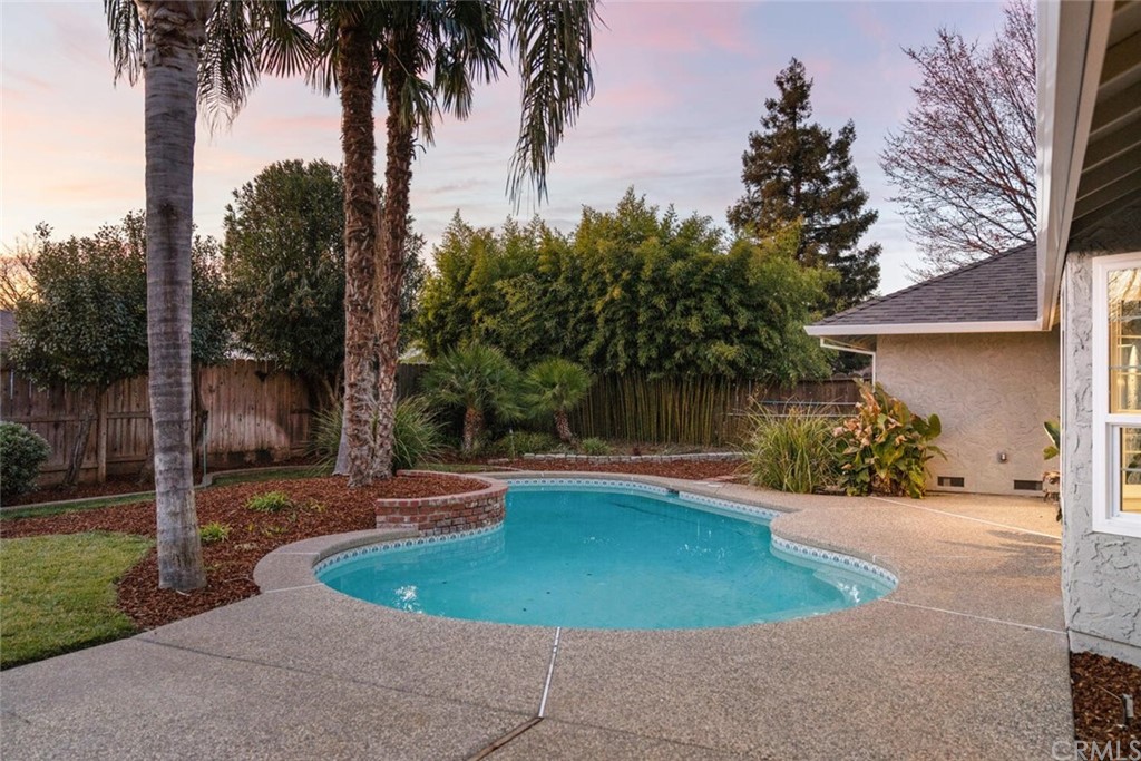 1985 Durango Way Chico, CA 95926 - Photo 61 of 65 a view of a swimming pool with a yard and palm trees