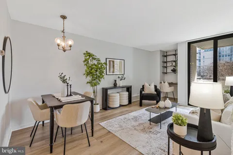 a view of a dining room with furniture window and wooden floor