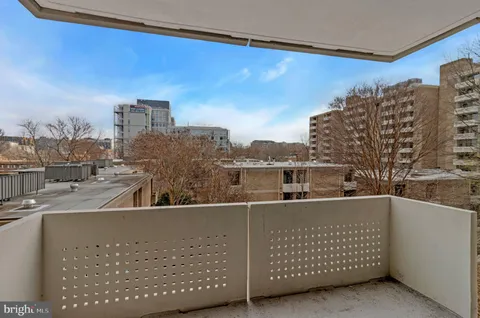 a view of roof deck with city view