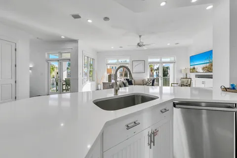 a kitchen with white cabinets and white appliances