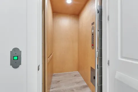 a view of a wooden chairs on the deck