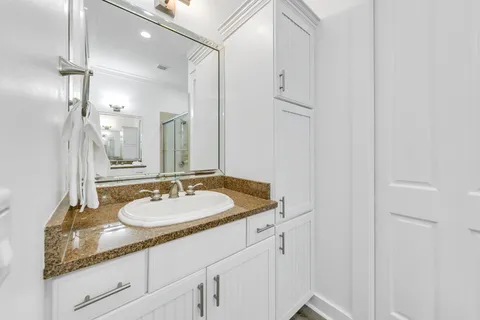 a bedroom with a large bed and a large window