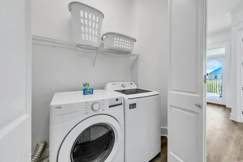 a kitchen with stainless steel appliances white cabinets and a stove top oven