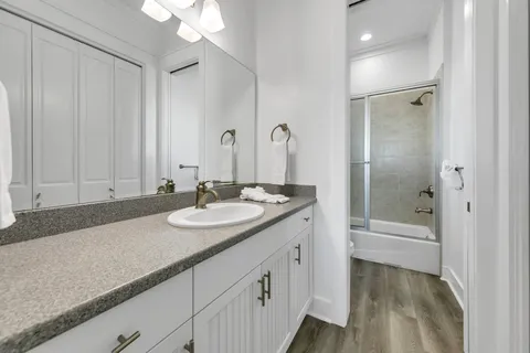 a balcony with furniture and wooden floor