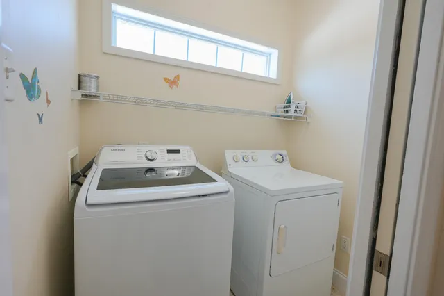 a view of a chairs and table in patio