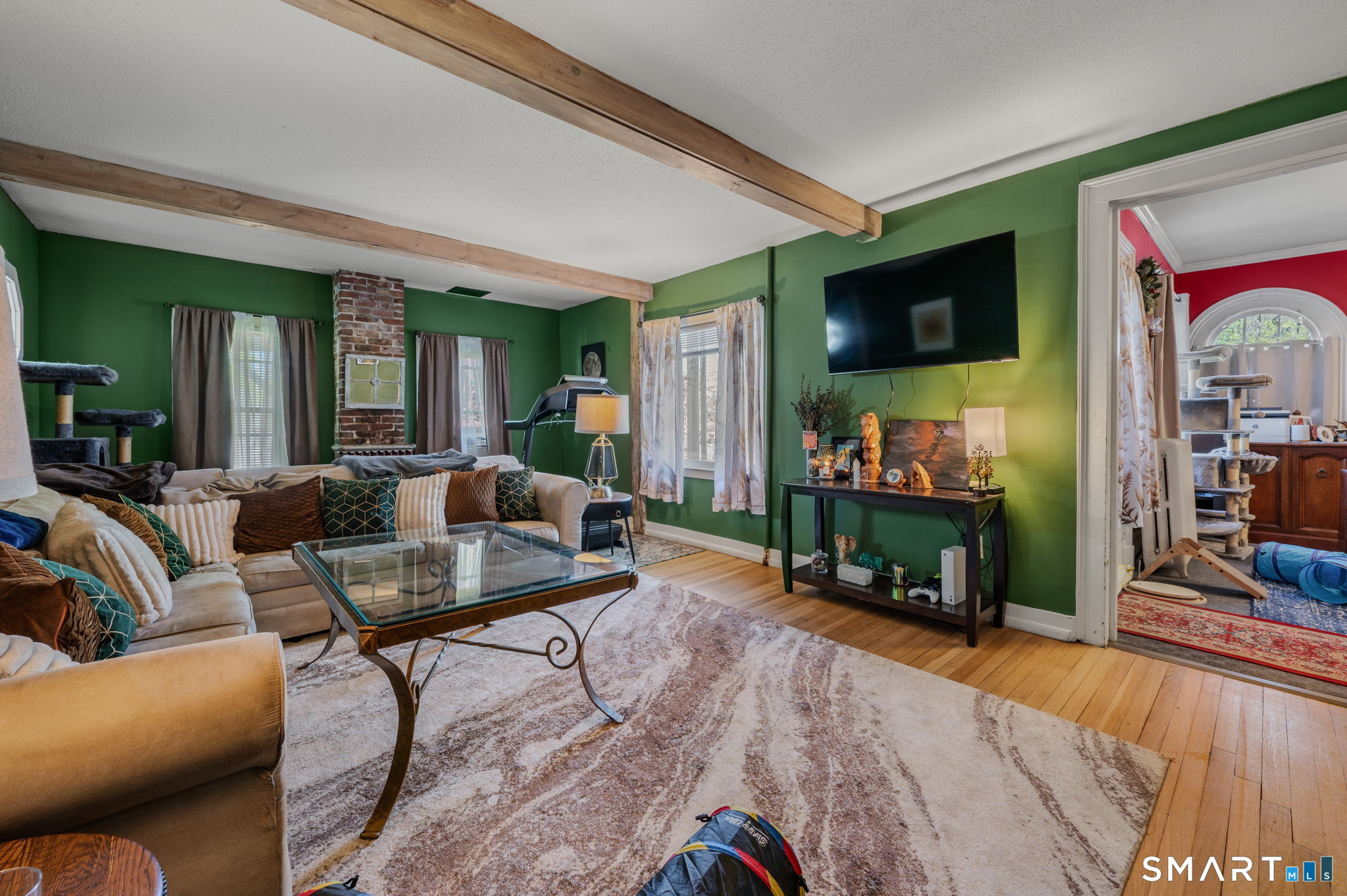 22 West High Street East Hampton, CT 06424 - Photo 11 of 40 a living room with fireplace furniture and a flat screen tv