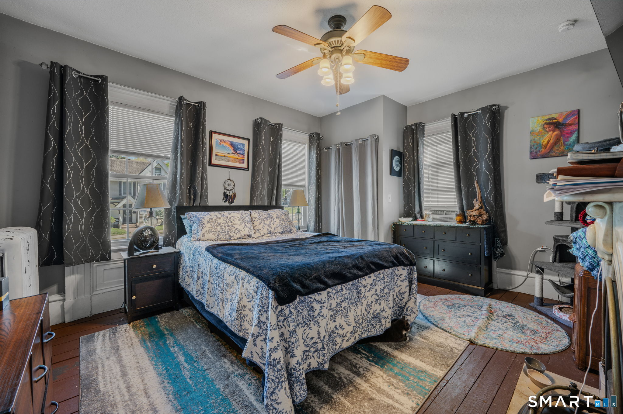 22 West High Street East Hampton, CT 06424 - Photo 14 of 40 a bedroom with a bed and a chandelier