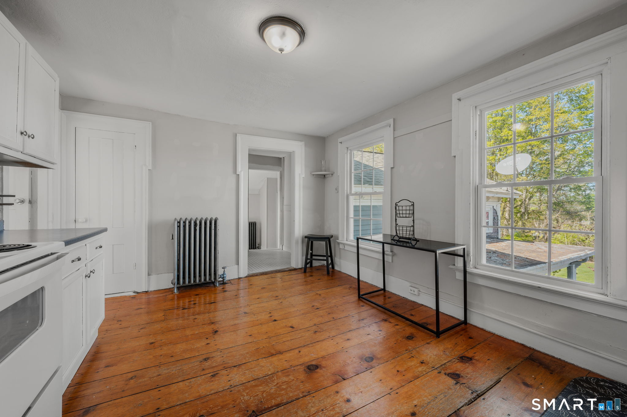 22 West High Street East Hampton, CT 06424 - Photo 21 of 40 a spacious bedroom with a bed and large window
