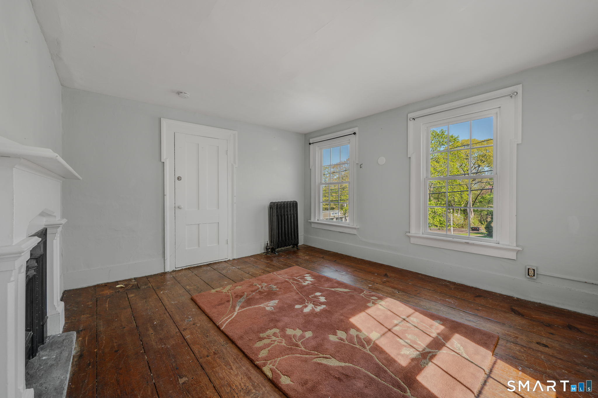 22 West High Street East Hampton, CT 06424 - Photo 25 of 40 a view of an empty room with window and a kitchen