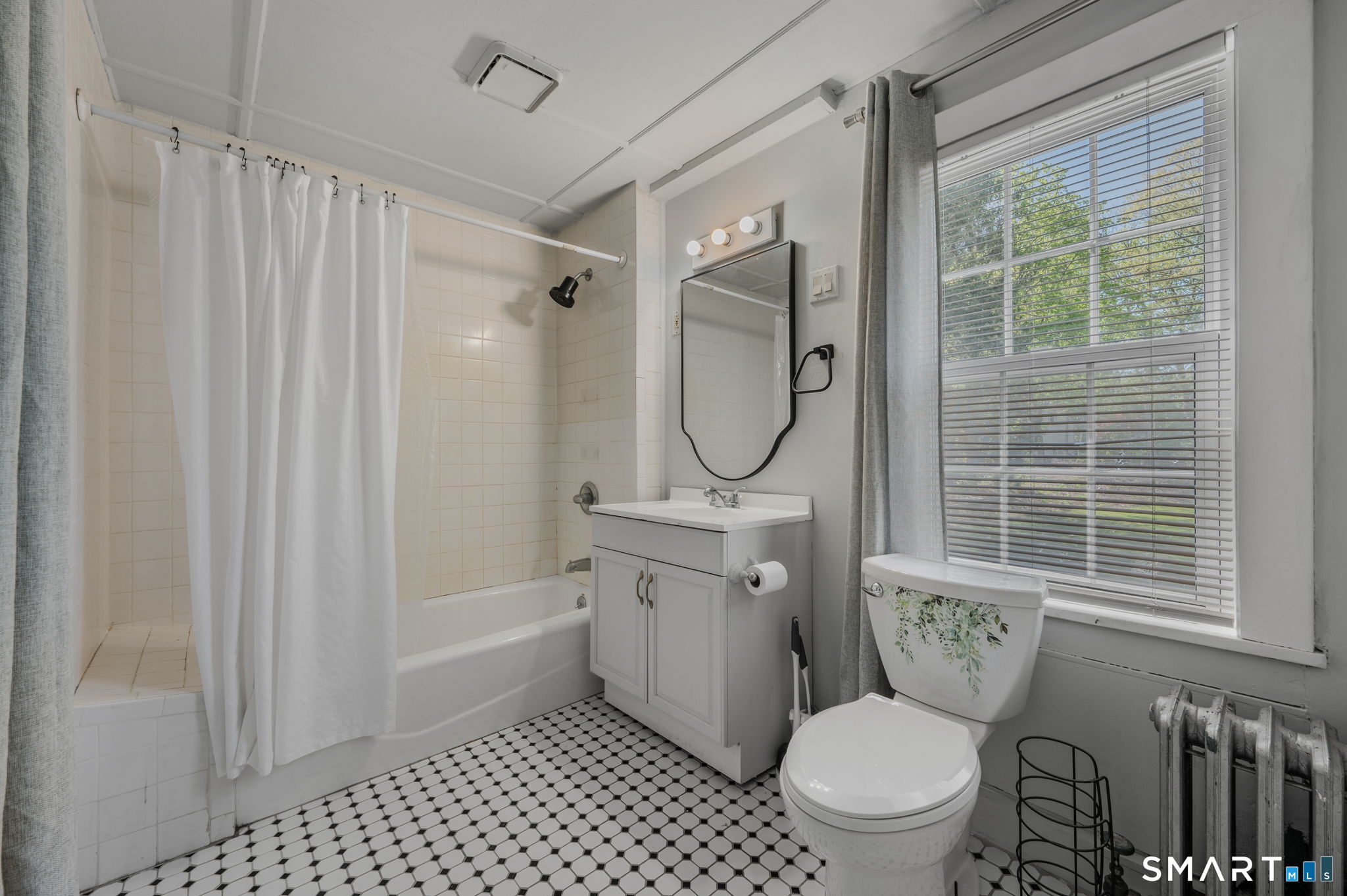 22 West High Street East Hampton, CT 06424 - Photo 27 of 40 a bathroom with a toilet sink vanity and shower